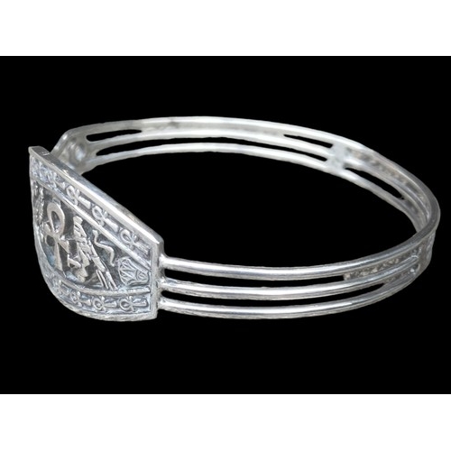 412 - A HEAVY EGYPTIAN THEMED SILVER BRACELET