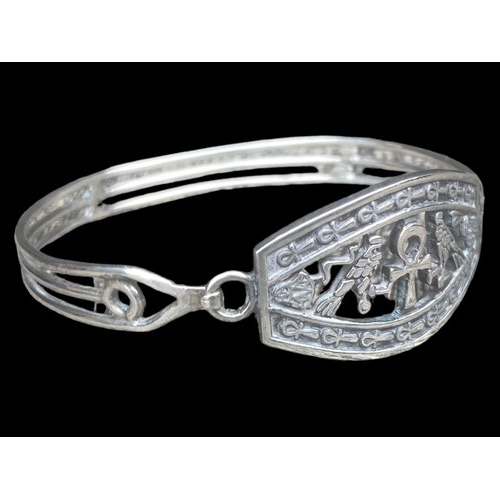 412 - A HEAVY EGYPTIAN THEMED SILVER BRACELET