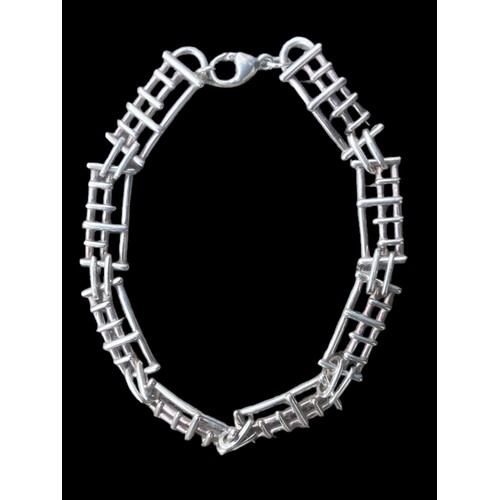 435 - A SILVER DESIGNER BRACELET