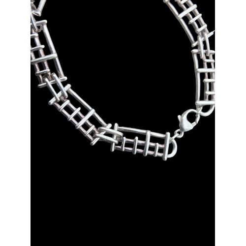 435 - A SILVER DESIGNER BRACELET