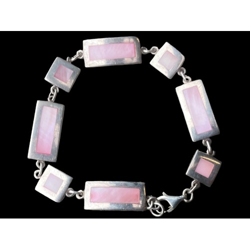 457 - A HEAVY SILVER MULTI LINK MOTHER OF PEARL BRACELET