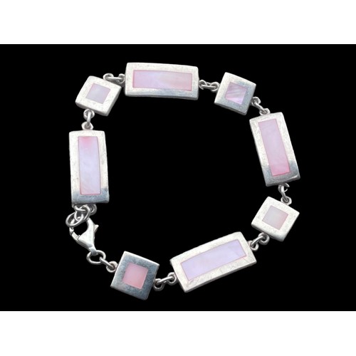 457 - A HEAVY SILVER MULTI LINK MOTHER OF PEARL BRACELET