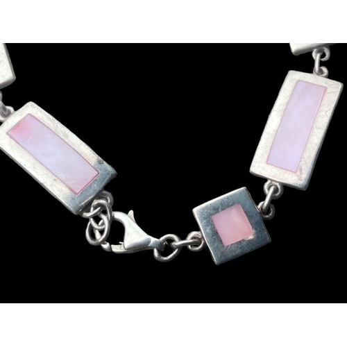 457 - A HEAVY SILVER MULTI LINK MOTHER OF PEARL BRACELET