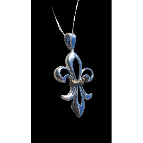 498 - A SILVER FLUER DE LIS PENDANT ON A SILVER CHAIN