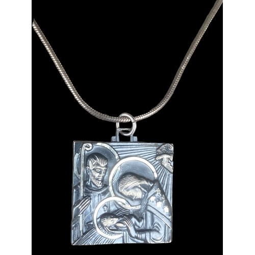 503 - A HEAVY SILVER RELIGIOUS PENDANT ON A SILVER CHAIN (OF HIGH QUALITY) 25.85grm