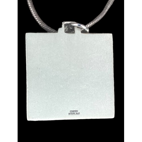 503 - A HEAVY SILVER RELIGIOUS PENDANT ON A SILVER CHAIN (OF HIGH QUALITY) 25.85grm