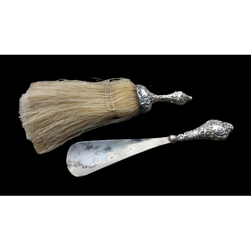 506 - A CHESTER SILVER SHOE HORN AND SILVER TABLE TOP BRUSH