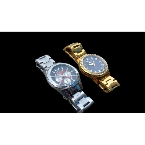 538 - 2 WATCHES ...ONE FOSSIL BRAND STAINLESS STEEL....ONE GUESS GOLD PLATED