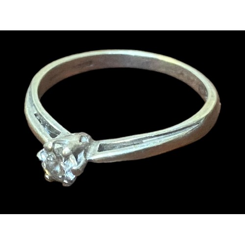 540 - A HIGH SET 9CT WHITE GOLD SOLITAIRE RING