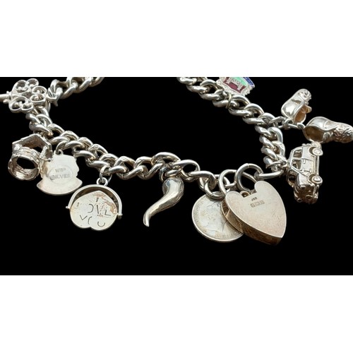 546 - A BEAUTIFUL SILVER CHARM BRACELET COMPLETE WITH SILVER CHARMS 51gms