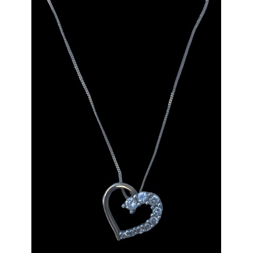 563 - A 9ct GOLD HEART PENDANT ON A 9ct GOLD CHAIN