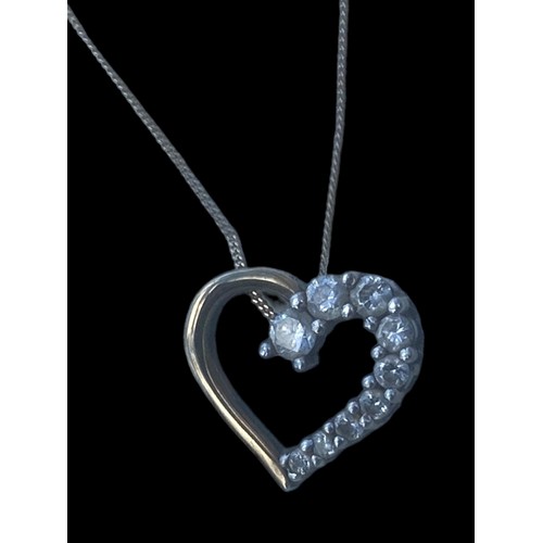 563 - A 9ct GOLD HEART PENDANT ON A 9ct GOLD CHAIN