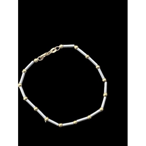 564 - A 9ct GOLD BALL AND BAR BRACELET