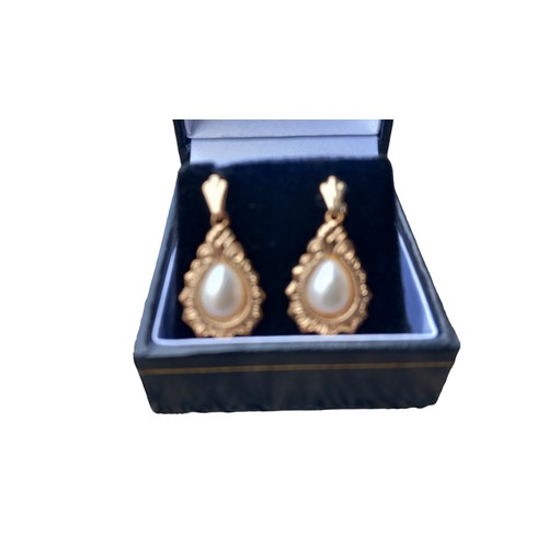 576 - A PAIR OF 9ct GOLD PEAR DROP EARRINGS