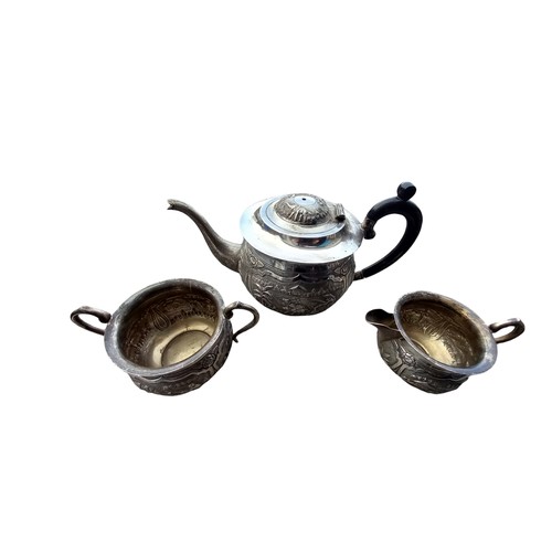 581 - A 3 PIECE STERLING SILVER TEA SERVICE IN ORNATE ORIENTAL PATTERN        grm