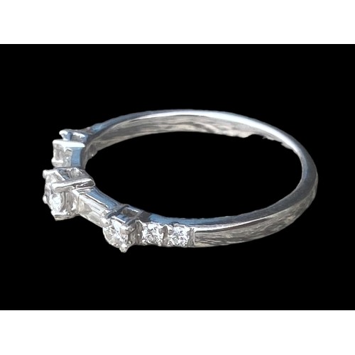 575A - 750k ETERNITY RING WITH 6 CUT DIAMONDS AND 2 BAGUETTE CUT DIAMONDS SIZE O 2.48gms