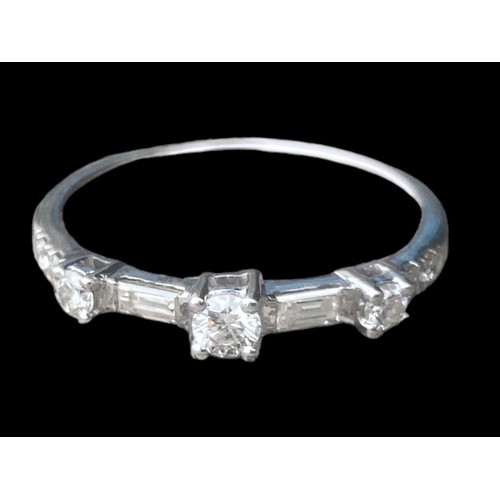 575A - 750k ETERNITY RING WITH 6 CUT DIAMONDS AND 2 BAGUETTE CUT DIAMONDS SIZE O 2.48gms