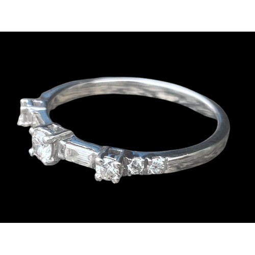 575A - 750k ETERNITY RING WITH 6 CUT DIAMONDS AND 2 BAGUETTE CUT DIAMONDS SIZE O 2.48gms