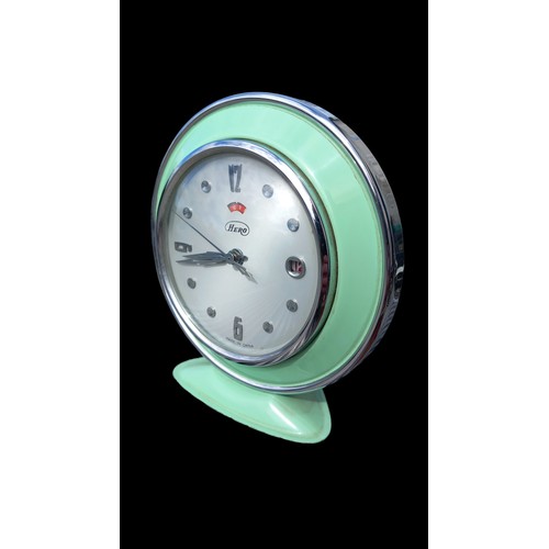 420A - A RETO GREEN CALANDER CLOCK BY HERO WITH CHROME HANDLES AND CHROME FINISH WITH BEVELLED GLASS FRONT ... 