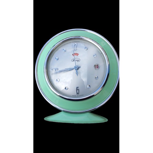 420A - A RETO GREEN CALANDER CLOCK BY HERO WITH CHROME HANDLES AND CHROME FINISH WITH BEVELLED GLASS FRONT ... 