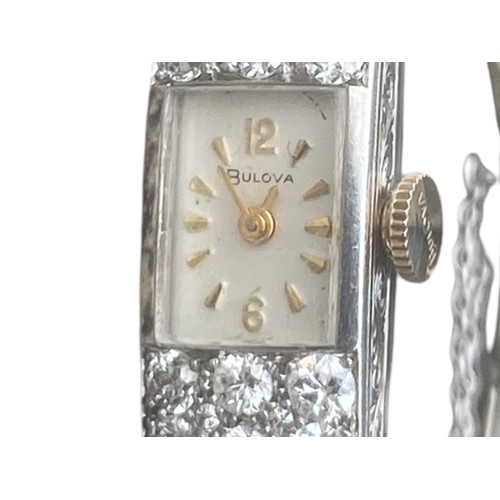 590A - 9ct GOLD BULOVA DIAMOND SET WATCH 4 CARATS OF DIAMONDS