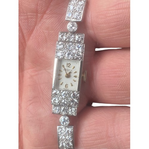 590A - 9ct GOLD BULOVA DIAMOND SET WATCH 4 CARATS OF DIAMONDS