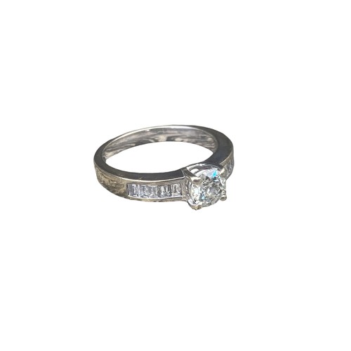 575C - 18ct WHITE GOLD SINGLE STONE DIAMOND RING SET WITH 5 BAGUETTE CUT DIAMONDS TO EACH SHOULDER 4.95gms