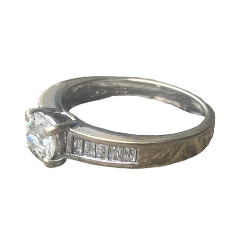 575C - 18ct WHITE GOLD SINGLE STONE DIAMOND RING SET WITH 5 BAGUETTE CUT DIAMONDS TO EACH SHOULDER 4.95gms