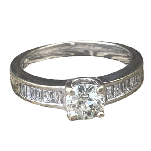 575C - 18ct WHITE GOLD SINGLE STONE DIAMOND RING SET WITH 5 BAGUETTE CUT DIAMONDS TO EACH SHOULDER 4.95gms