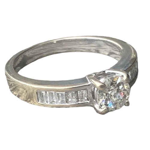 575C - 18ct WHITE GOLD SINGLE STONE DIAMOND RING SET WITH 5 BAGUETTE CUT DIAMONDS TO EACH SHOULDER 4.95gms