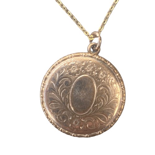 244 - A BEAUTIFUL YELLOW METAL CIRCULAR LOCKET AND CHAIN