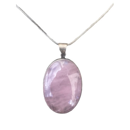 264 - A ROSE QUARTZ PENDANT ON A LONG SILVER CHAIN