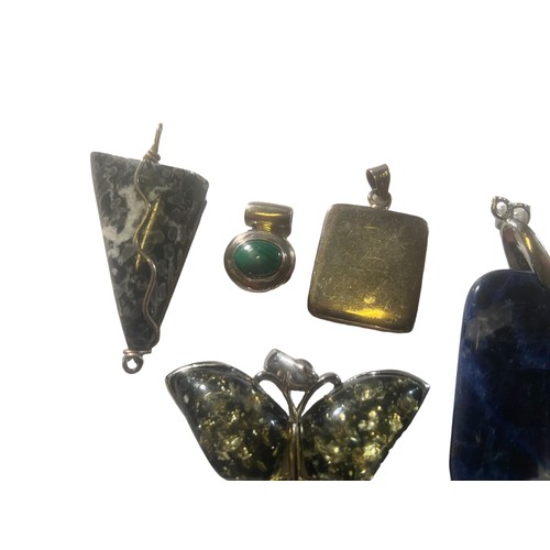 283 - SELECTION OF SILVER MOUNTED PENDANTS