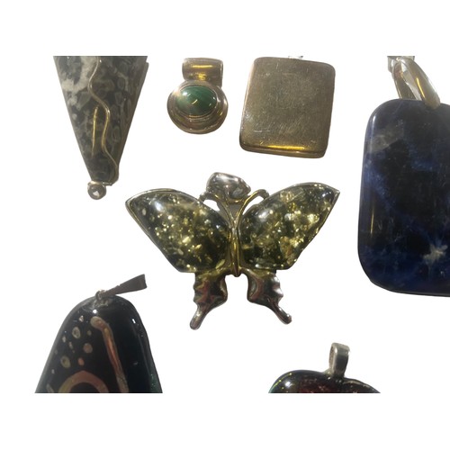 283 - SELECTION OF SILVER MOUNTED PENDANTS