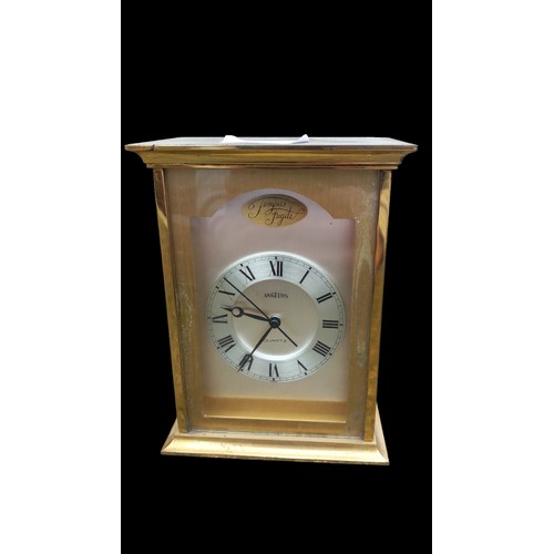 23 - A BRASS CLOCK