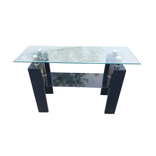 34 - A BLACK GLASS CONSOL TABLE