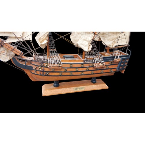 71 - A VINTAGE WOODEN MODEL OF H.M.S VICTORY 21x17