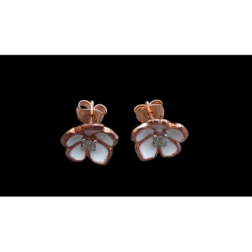 210 - SILVER EARRINGS IN FLORAL SETTING WITH DIAMOND CENTRE