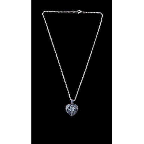 217 - A SILVER AND MARCASITE HEART PENDANT ON A HEAVY SILVER TWIST CHAIN