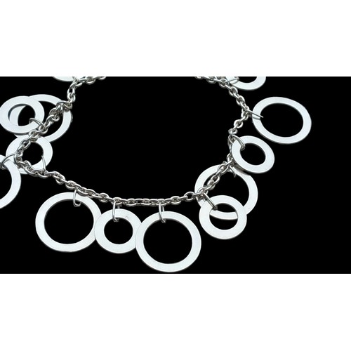 257 - A SILVER BRACELET SET WITH SILVER CIRCLES