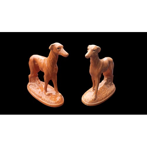 320 - A PAIR OF BROWN CERAMIC GREYHOUND FIGURINES 6x7