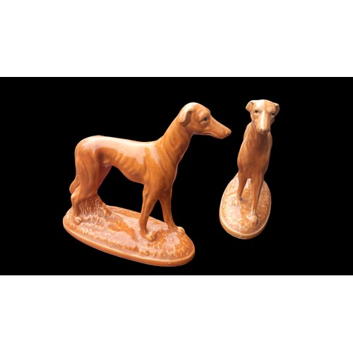 320 - A PAIR OF BROWN CERAMIC GREYHOUND FIGURINES 6x7