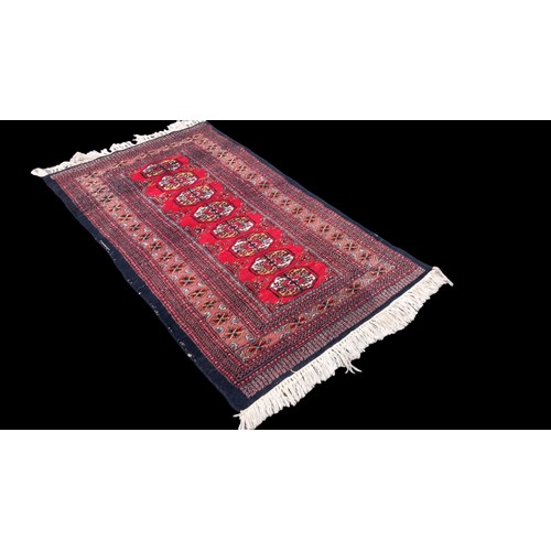 386 - A VERY NICE MULTI COLOUR HAND MADE AFGAN RUG 53X30.5