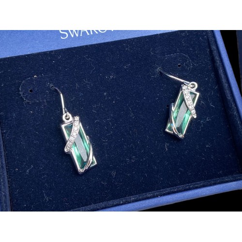 425 - A BOXED SWAROVSKI CRYSTAL BLUE EARRINGS