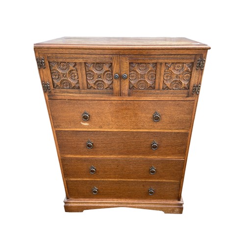 441 - AN ANTIQUE OAK CABINET OVER DRAWERS