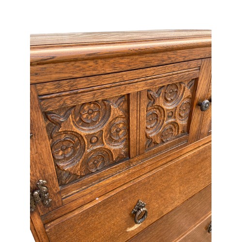 441 - AN ANTIQUE OAK CABINET OVER DRAWERS