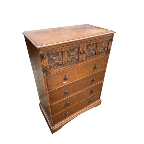 441 - AN ANTIQUE OAK CABINET OVER DRAWERS