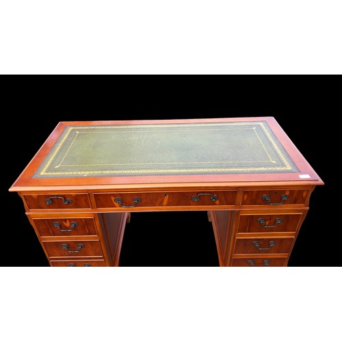 481 - A CHERRY WOOD TWIN PEDESTAL DESK WITH A LEATHER INSET TOP