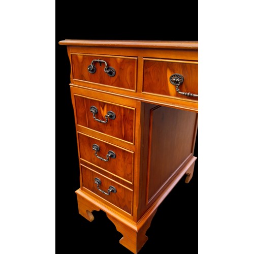 481 - A CHERRY WOOD TWIN PEDESTAL DESK WITH A LEATHER INSET TOP