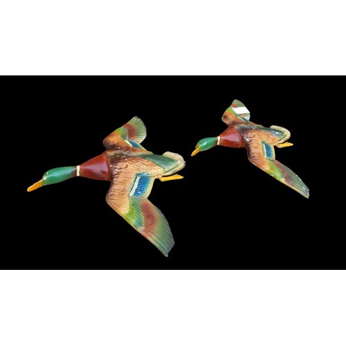 482 - A PAIR OF ANTIQUE CAST DUCKS IN FLIGHT 10x12